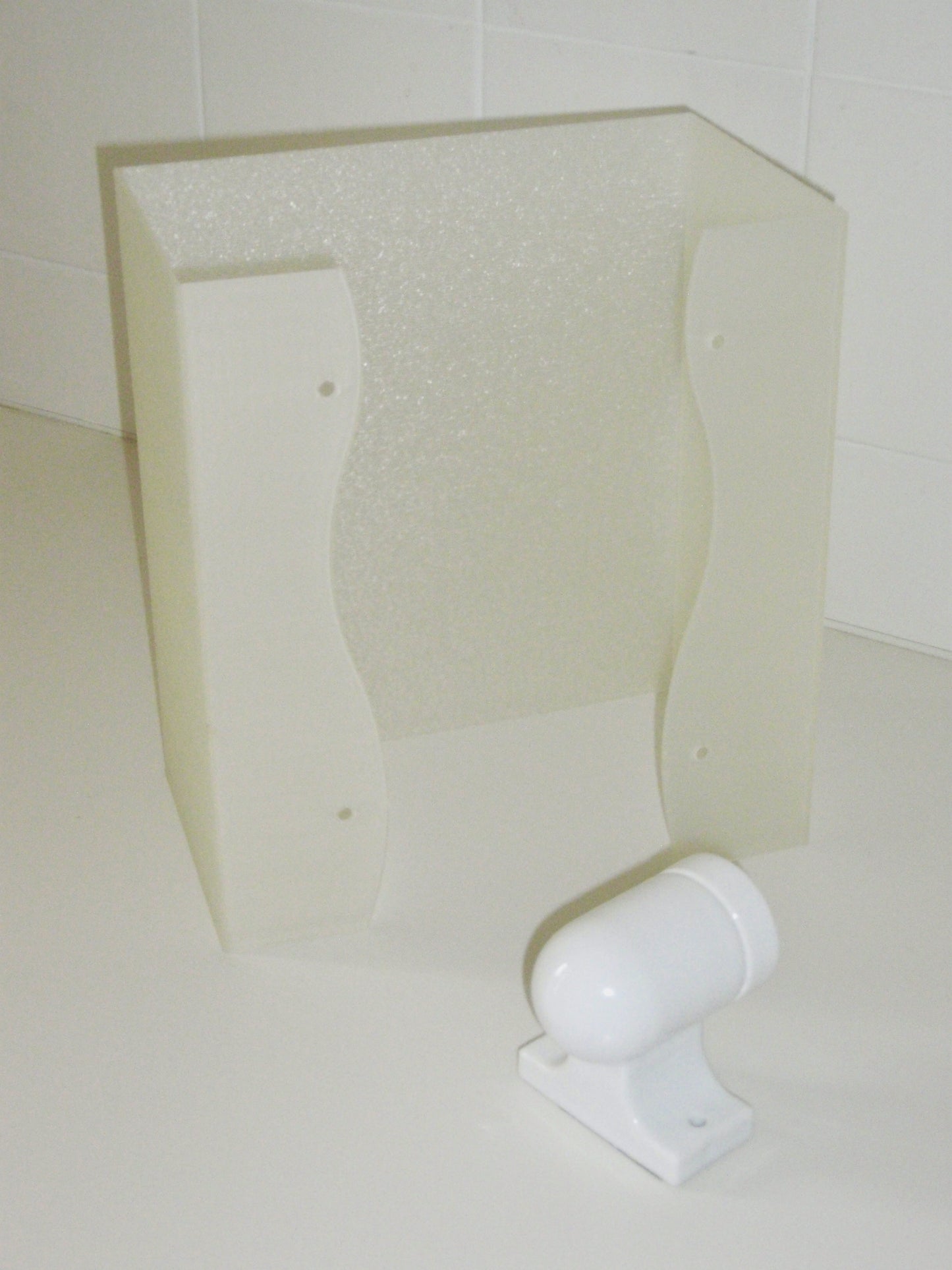 3D-printed wall sconce in matte texured translucent material, inspired by Japanese paper lanterns, designed by Argot Studio.