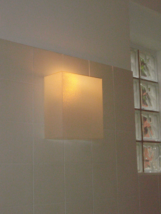 3D-printed wall sconce in matte texured translucent material, inspired by Japanese paper lanterns, designed by Argot Studio.