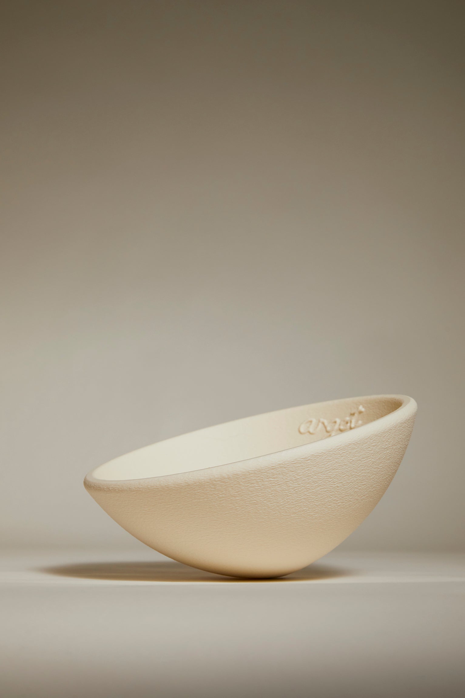 Beige curved bowl